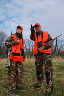 An experienced hunter working with a young hunter.